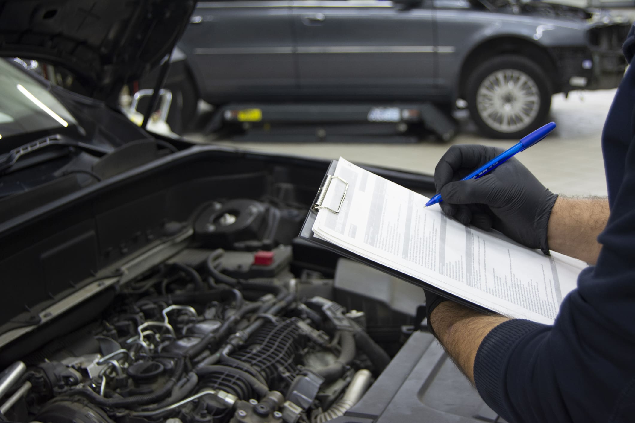 Car undergoing a service check by dealer